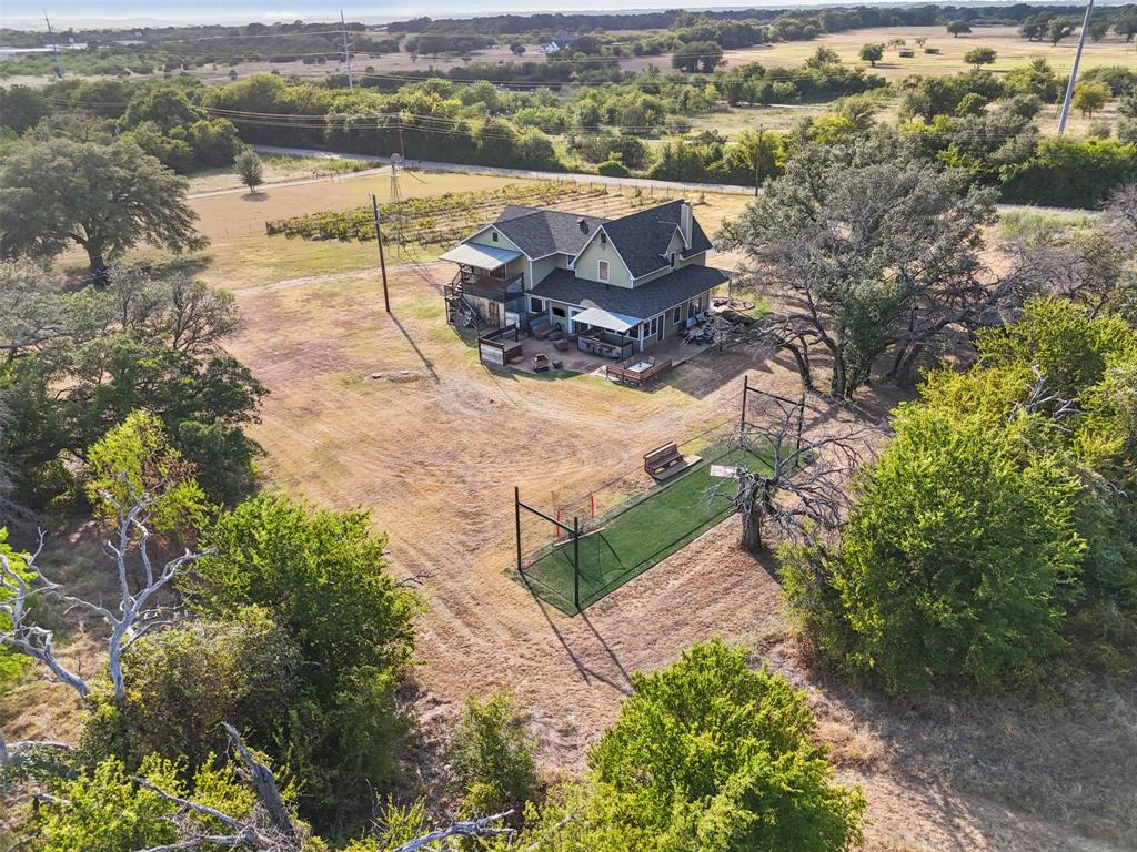 325 Bolton Road Granbury, TX 76049 - Photo 37 of 39 Aerial view of the full 5.529 acre gated, cross-fenced property with a private paved drive. Hood County acreage in Granbury ISD, room to spread out.