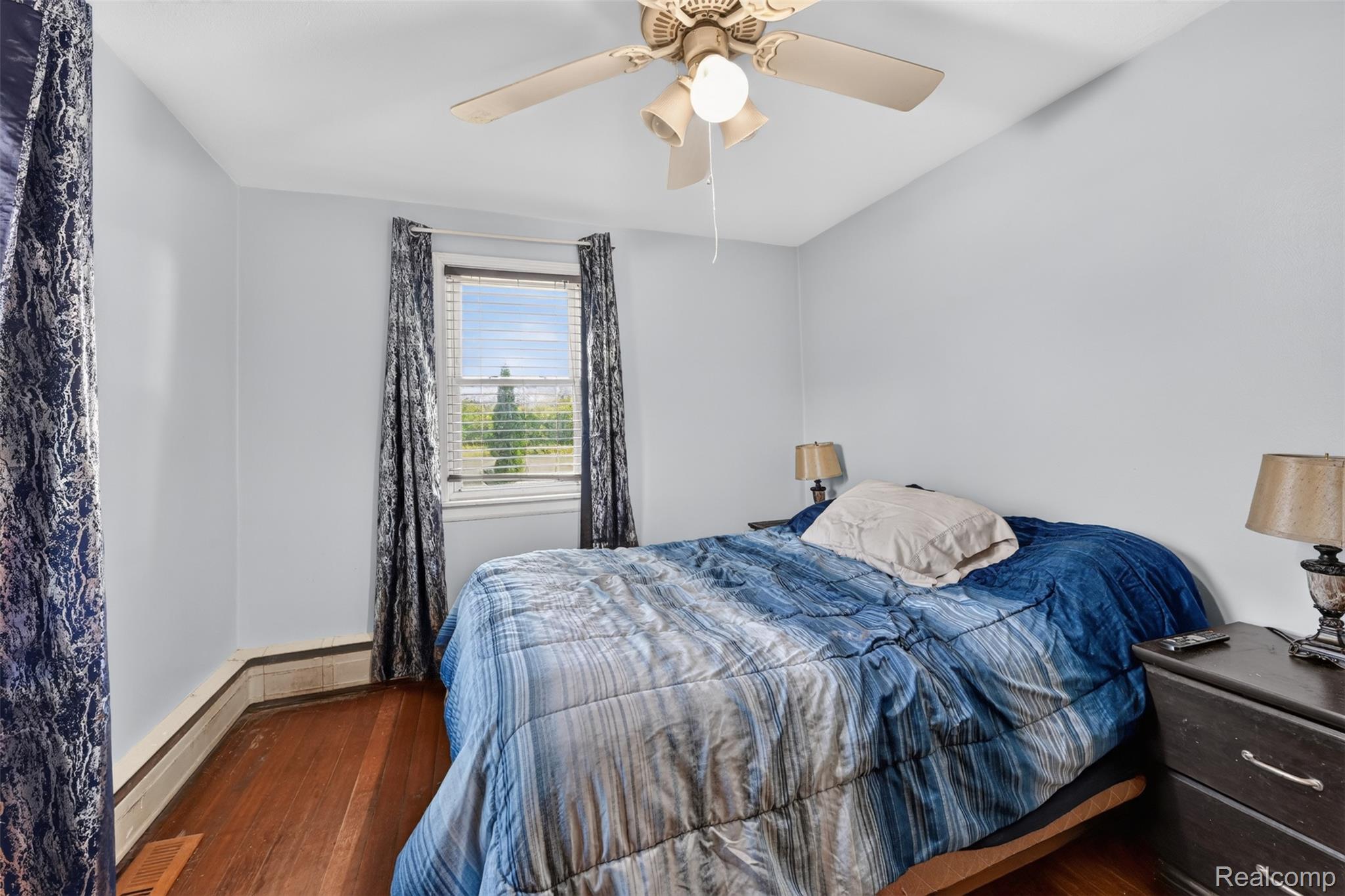 7369 North Webster Road Mount Morris, MI 48458 - Photo 24 of 56 Hardwood flooring, window with blinds, ceiling fan with integrated lighting, light-colored walls