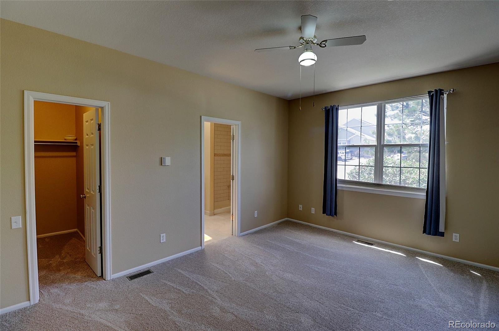 6203 Trailhead Road Highlands Ranch, CO 80130 - Photo 11 of 32 a view of an empty room with a window