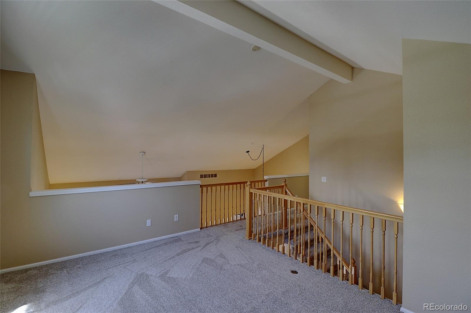 6203 Trailhead Road Highlands Ranch, CO 80130 - Photo 20 of 32 a view of a hallway with stairs