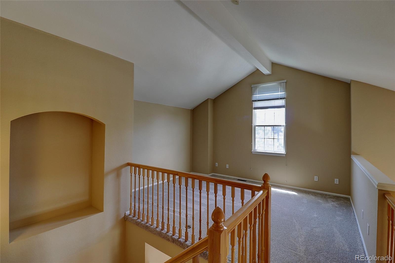6203 Trailhead Road Highlands Ranch, CO 80130 - Photo 23 of 32 a view of a hallway with windows
