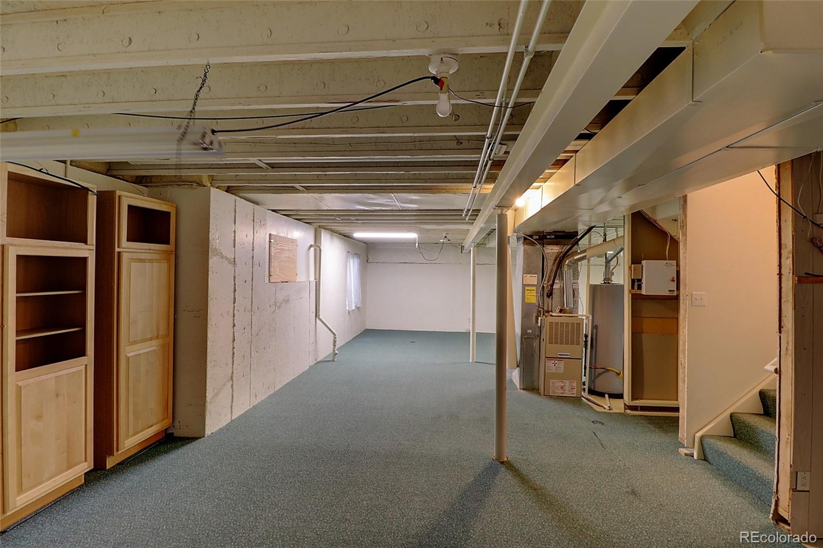 6203 Trailhead Road Highlands Ranch, CO 80130 - Photo 26 of 32 a view of empty room with wooden walls