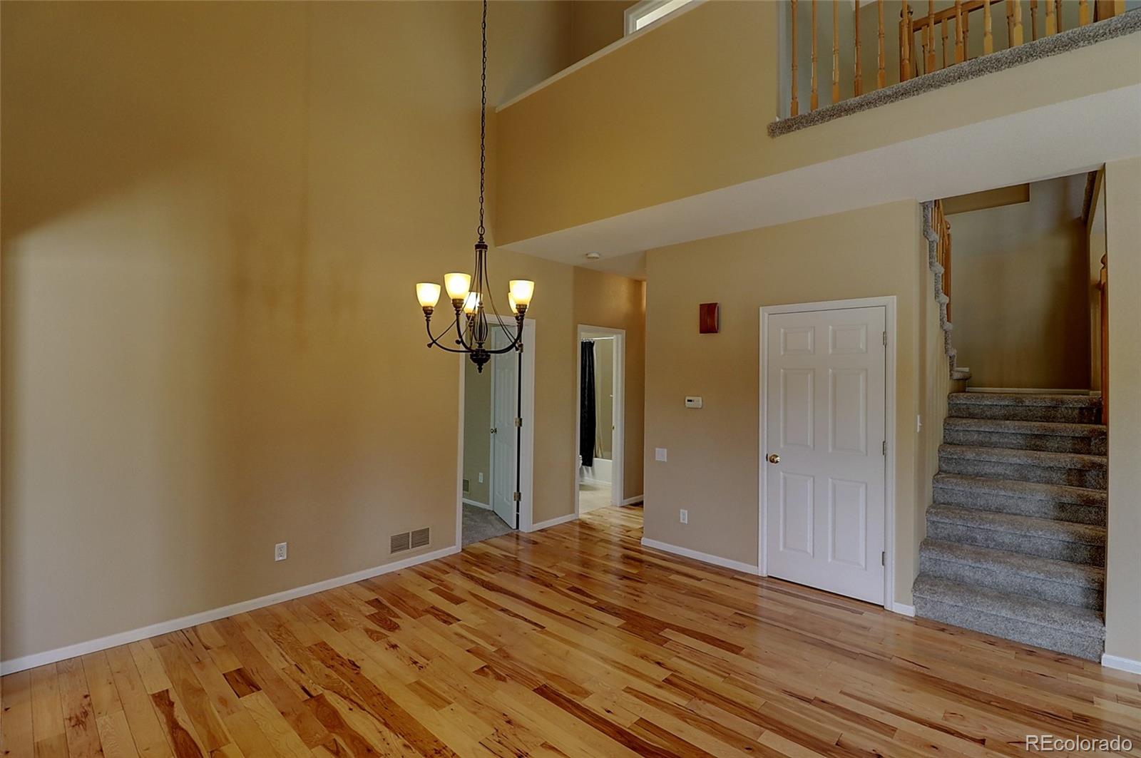 6203 Trailhead Road Highlands Ranch, CO 80130 - Photo 6 of 32 a view of a livingroom with wooden floor