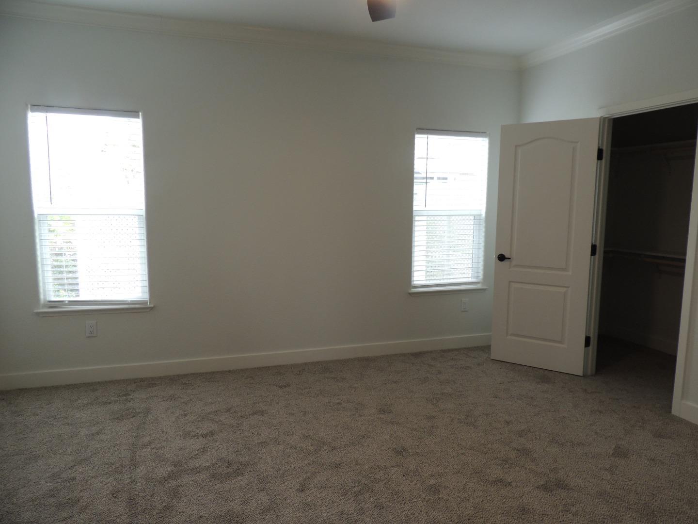 144 Holm Road, Unit 93 Watsonville, CA 95076 - Photo 11 of 15 an empty room with windows