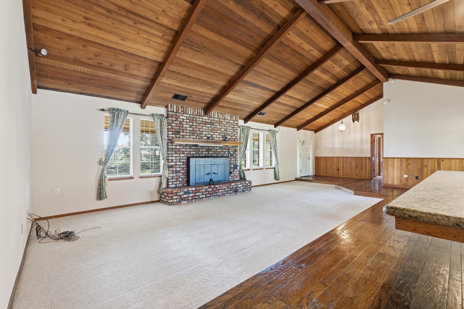7176 East Butler Avenue Fresno, CA 93737 - Photo 11 of 76 a view of empty room with fireplace and windows