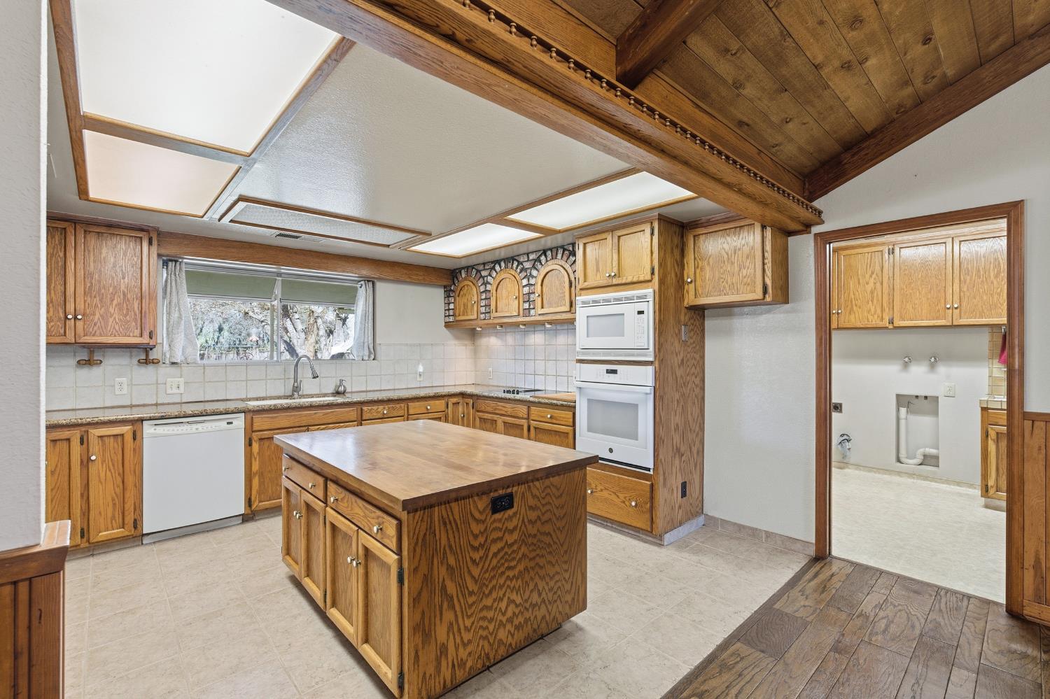 7176 East Butler Avenue Fresno, CA 93737 - Photo 16 of 76 a kitchen with stainless steel appliances granite countertop a sink and a refrigerator