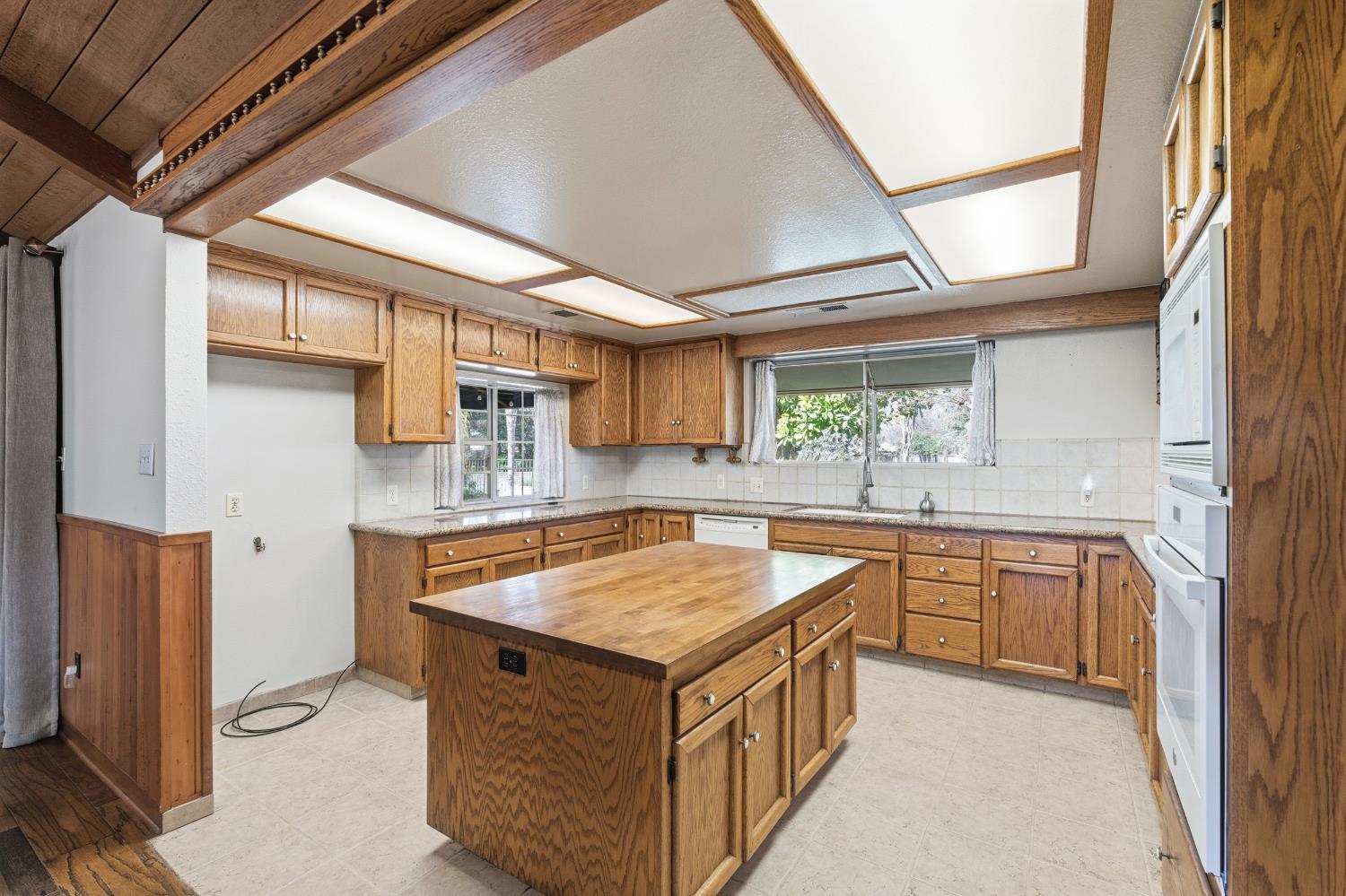 7176 East Butler Avenue Fresno, CA 93737 - Photo 17 of 76 a kitchen with stainless steel appliances granite countertop a stove and a sink
