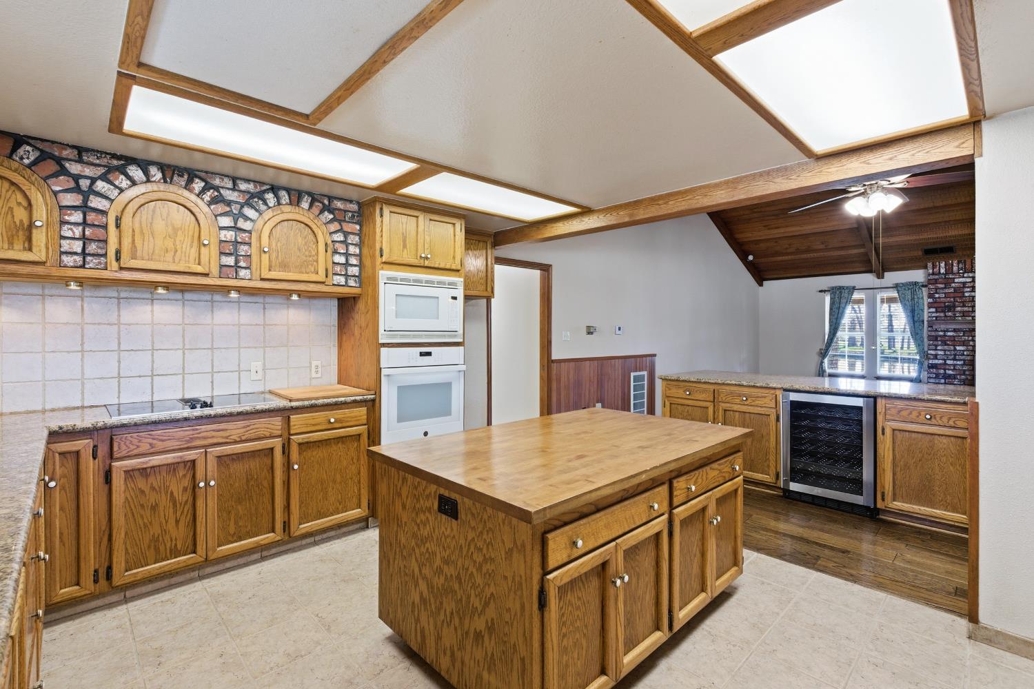 7176 East Butler Avenue Fresno, CA 93737 - Photo 20 of 76 a kitchen with stainless steel appliances granite countertop a sink and stove