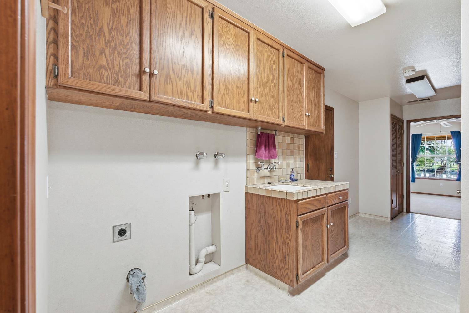 7176 East Butler Avenue Fresno, CA 93737 - Photo 23 of 76 a view of a kitchen with electric appliances