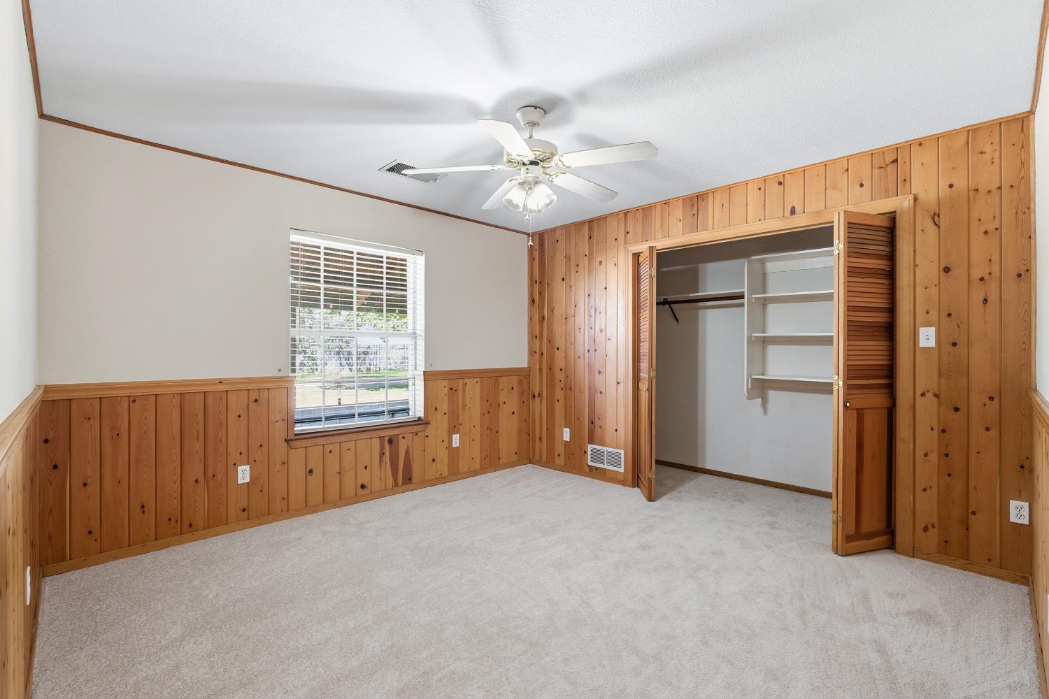 7176 East Butler Avenue Fresno, CA 93737 - Photo 28 of 76 a view of an empty room with a window