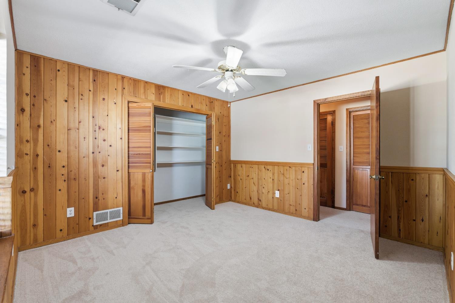 7176 East Butler Avenue Fresno, CA 93737 - Photo 29 of 76 a view of an empty room with a ceiling fan
