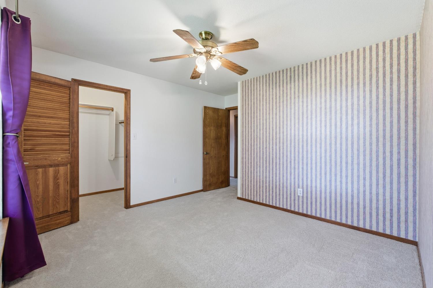 7176 East Butler Avenue Fresno, CA 93737 - Photo 38 of 76 a view of an empty room with a ceiling fan