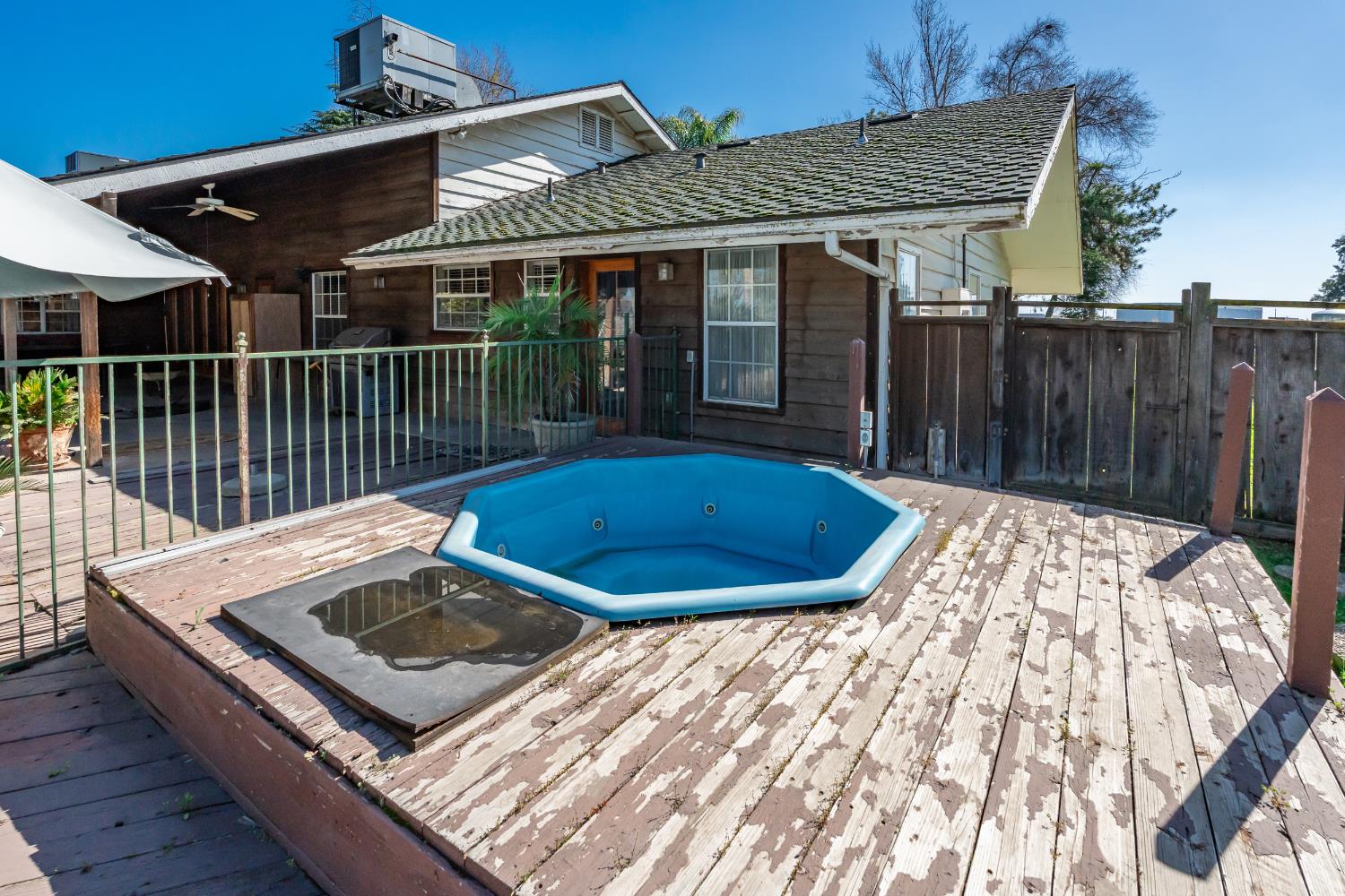 7176 East Butler Avenue Fresno, CA 93737 - Photo 49 of 76 a view of a roof deck with wooden fence