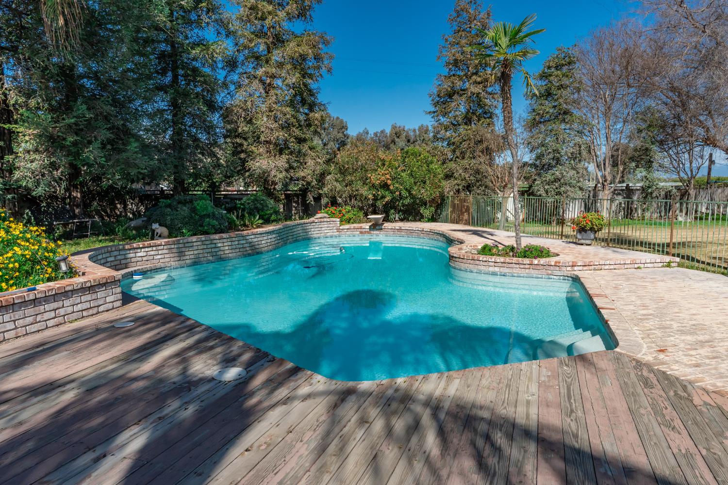 7176 East Butler Avenue Fresno, CA 93737 - Photo 50 of 76 a view of a swimming pool with an outdoor space