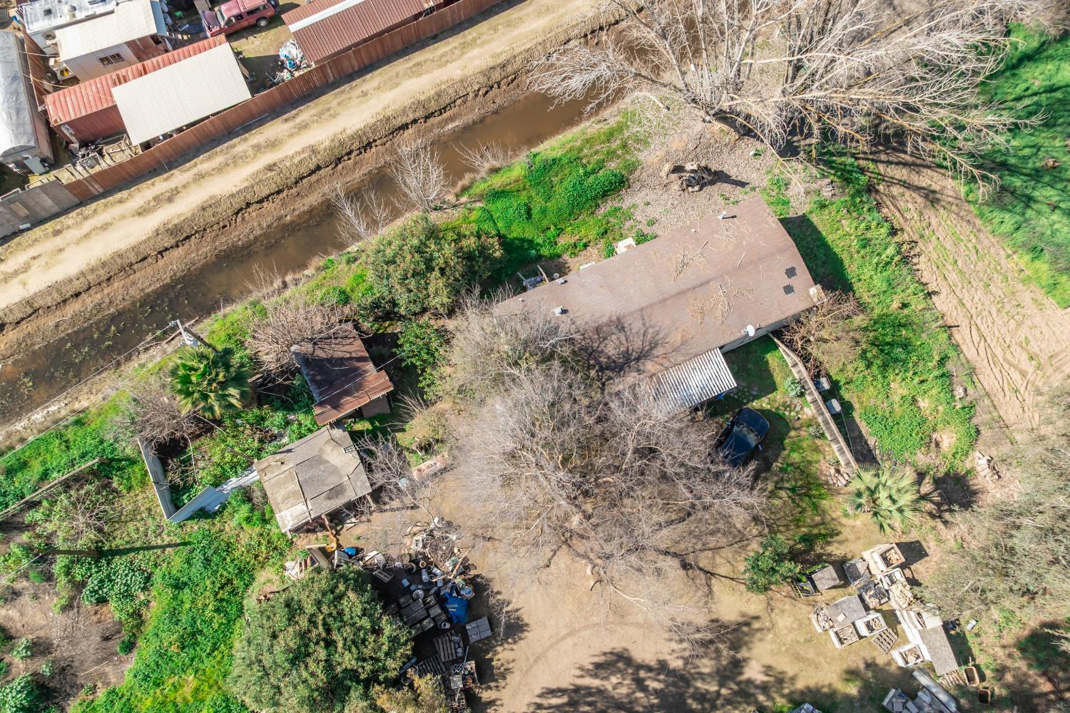 7176 East Butler Avenue Fresno, CA 93737 - Photo 66 of 76 a backyard of a house with a yard and outdoor seating