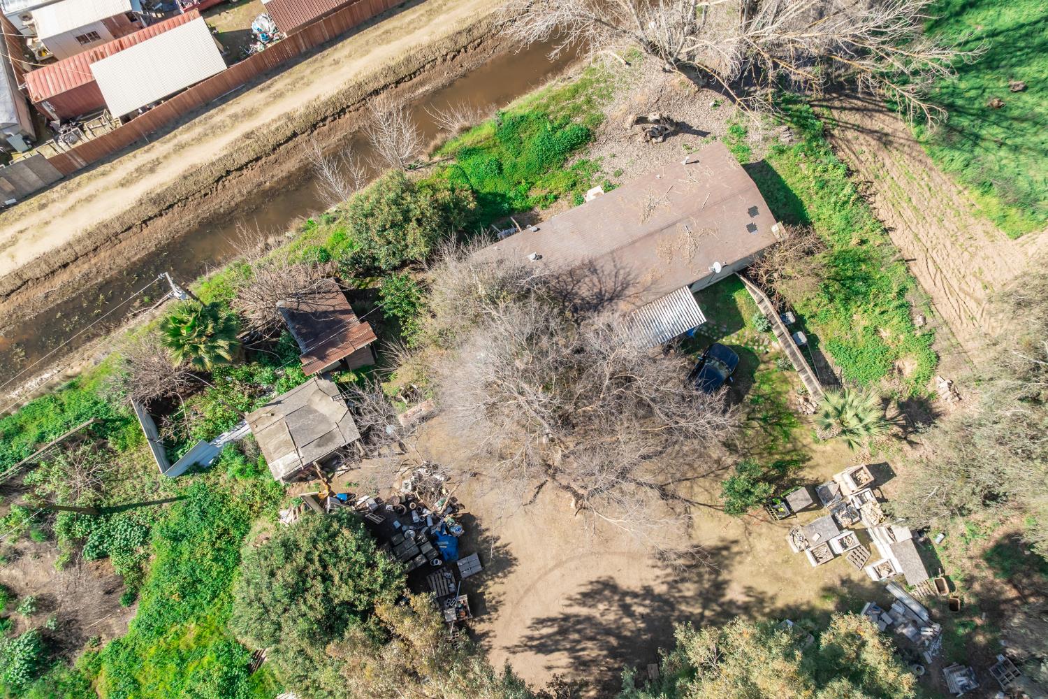 7176 East Butler Avenue Fresno, CA 93737 - Photo 67 of 76 a backyard of a house with a yard and outdoor seating