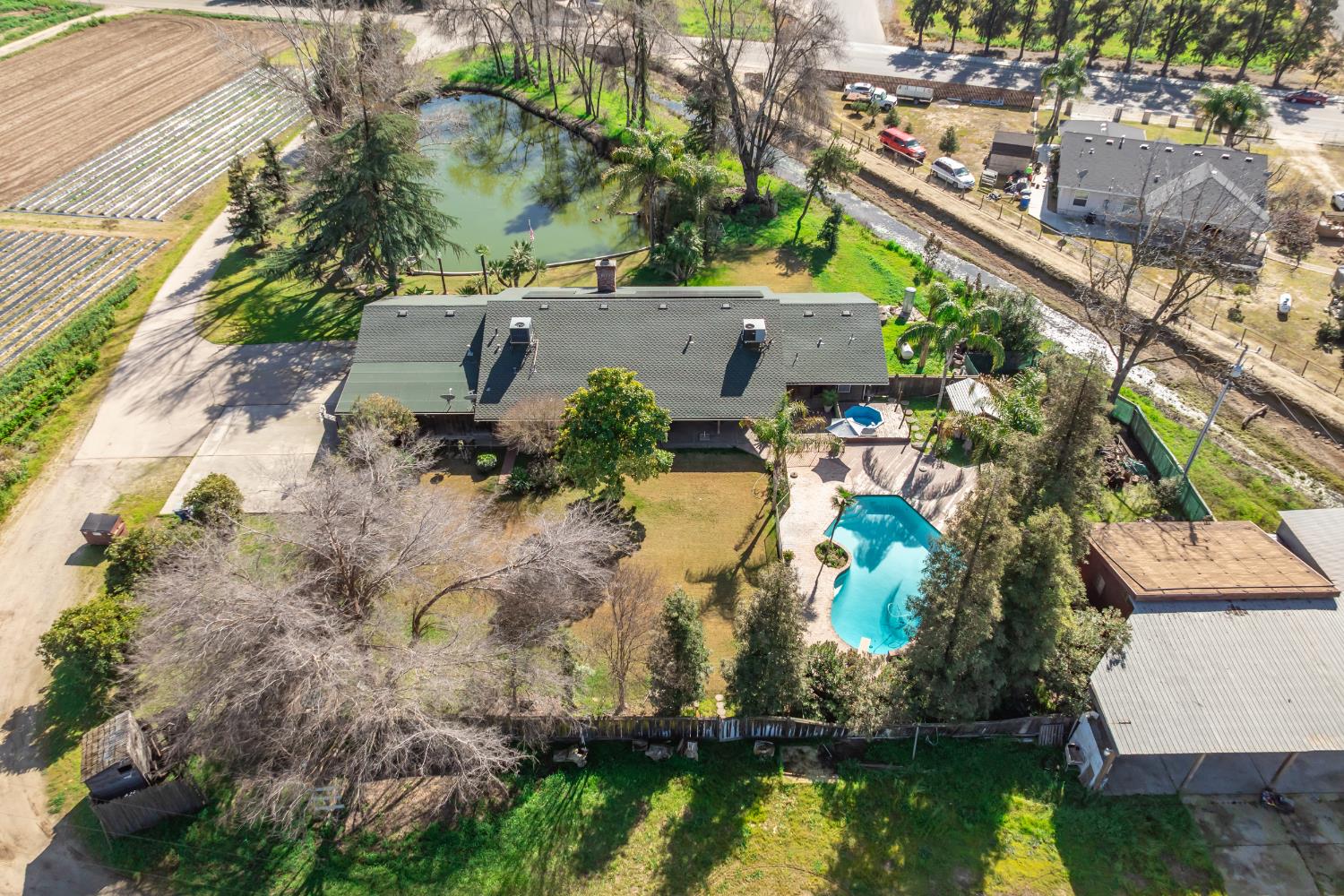 7176 East Butler Avenue Fresno, CA 93737 - Photo 70 of 76 an aerial view of house with yard swimming pool and outdoor seating