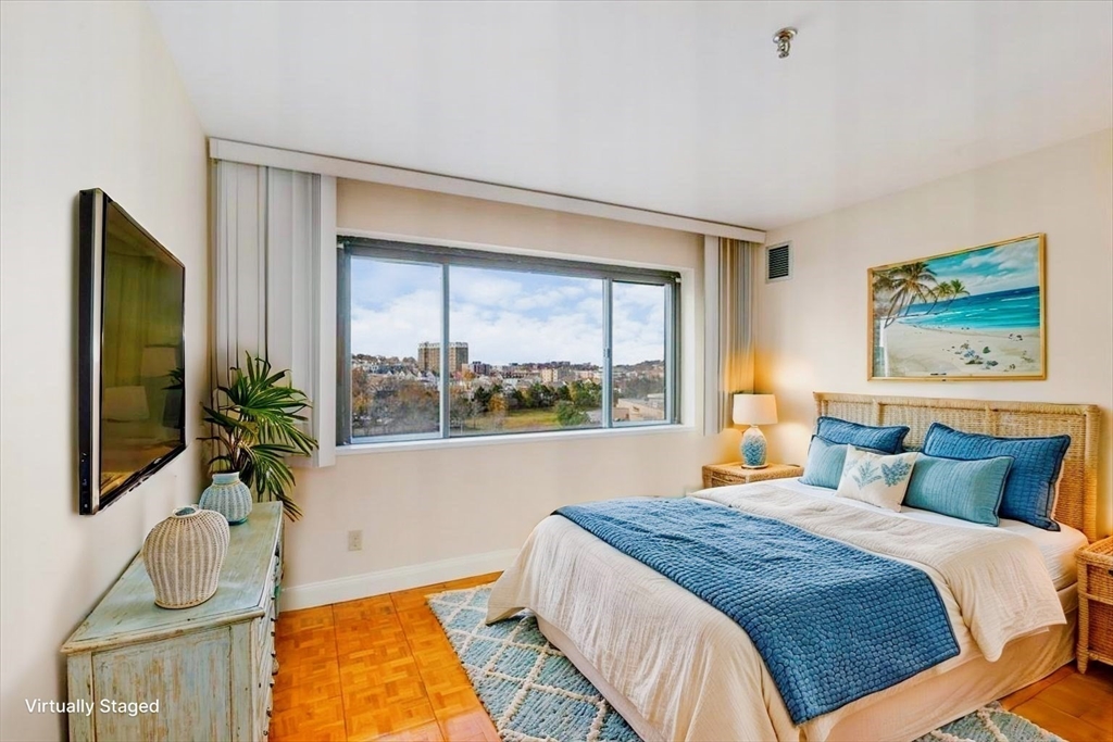 376 Ocean Avenue, Unit 709 Revere, MA 02151 - Photo 15 of 38 a bedroom with a bed and a flat screen tv