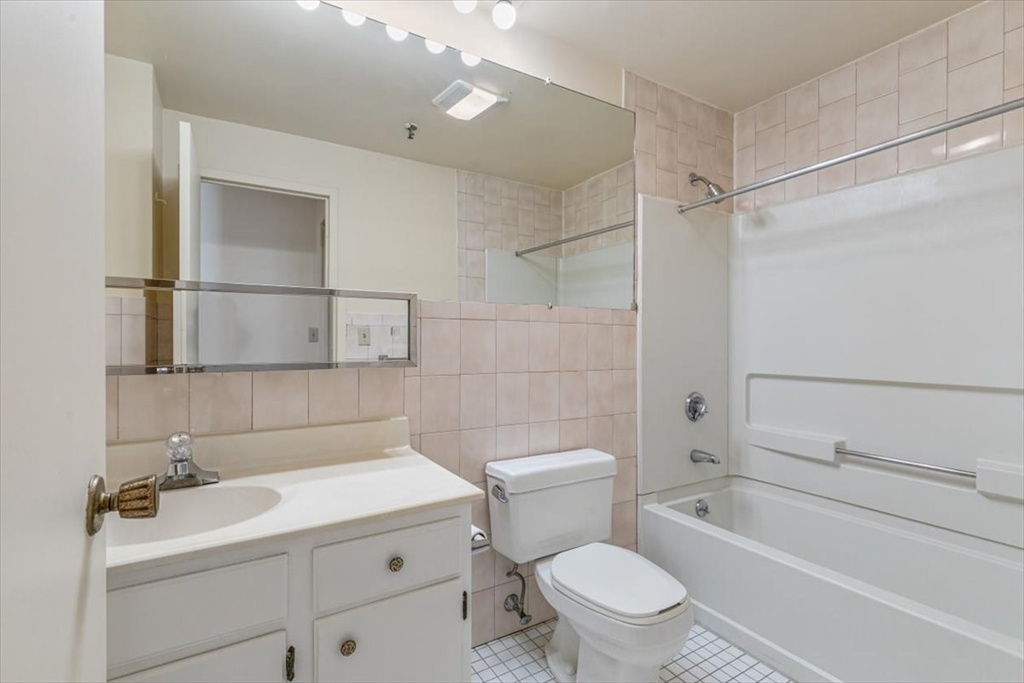376 Ocean Avenue, Unit 709 Revere, MA 02151 - Photo 18 of 38 a bathroom with a sink toilet vanity and shower