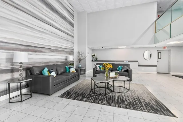 a living room with furniture and a table