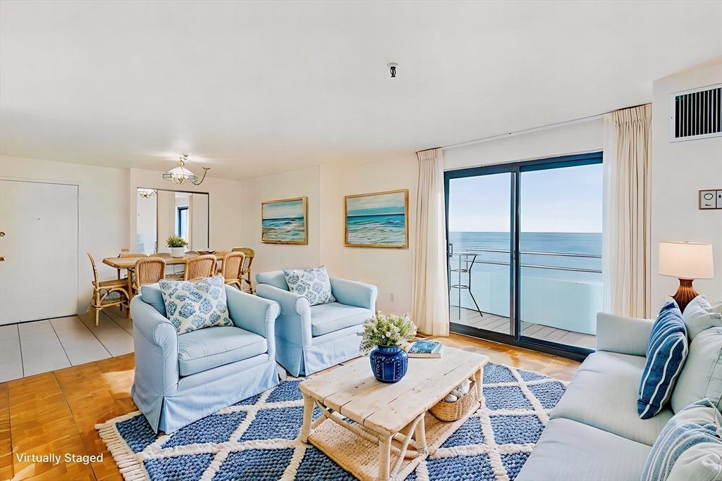 376 Ocean Avenue, Unit 709 Revere, MA 02151 - Photo 6 of 38 a living room with furniture and a large window