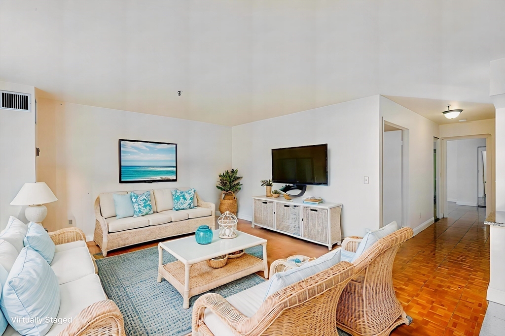 376 Ocean Avenue, Unit 709 Revere, MA 02151 - Photo 9 of 38 a bedroom with furniture and a flat screen tv