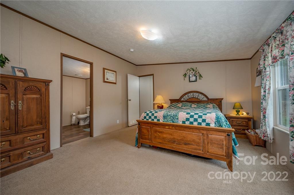 628 Hamilton Road Rutherfordton, NC 28139 - Photo 18 of 35 a bedroom with furniture and a window