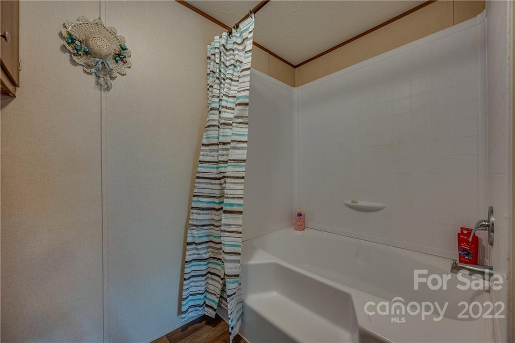 628 Hamilton Road Rutherfordton, NC 28139 - Photo 20 of 35 a bathroom with a shower and a bath tub