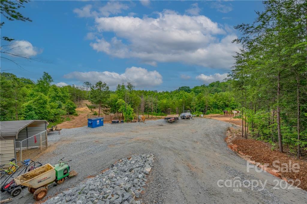 628 Hamilton Road Rutherfordton, NC 28139 - Photo 2 of 35 a view of a road with fire pit
