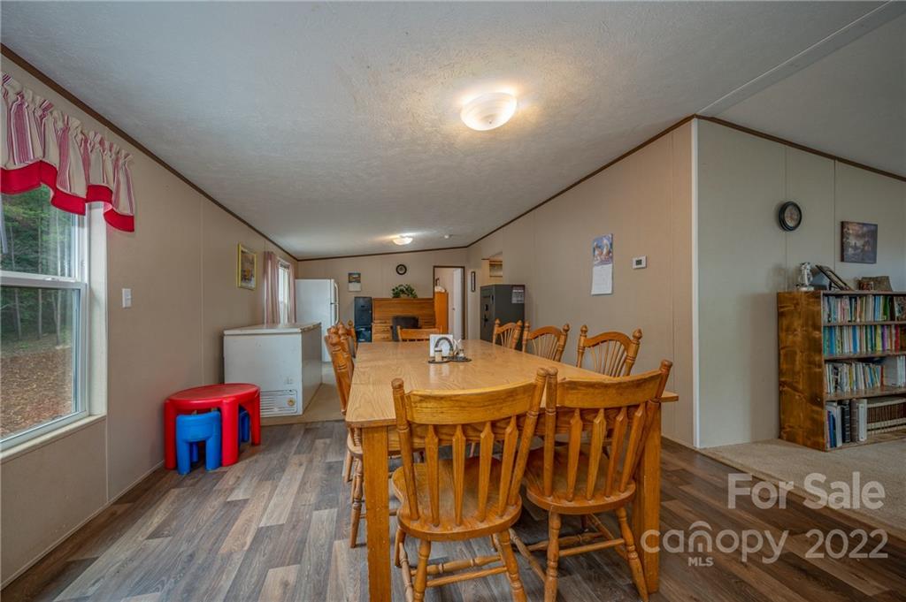 628 Hamilton Road Rutherfordton, NC 28139 - Photo 25 of 35 a view of a dining room with furniture and wooden floor