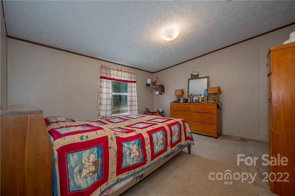 628 Hamilton Road Rutherfordton, NC 28139 - Photo 27 of 35 a bedroom with a bed and window