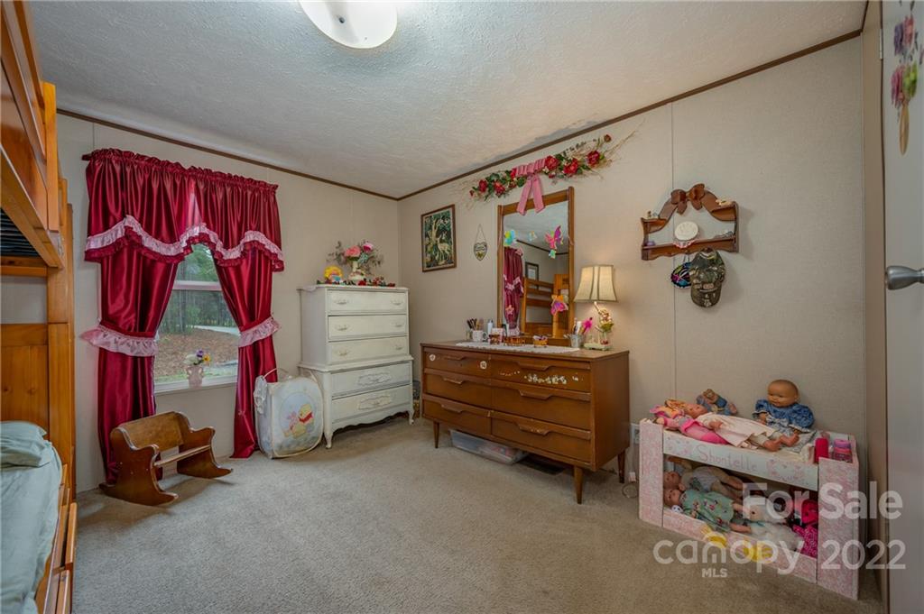628 Hamilton Road Rutherfordton, NC 28139 - Photo 32 of 35 a bed room with a bed and a window