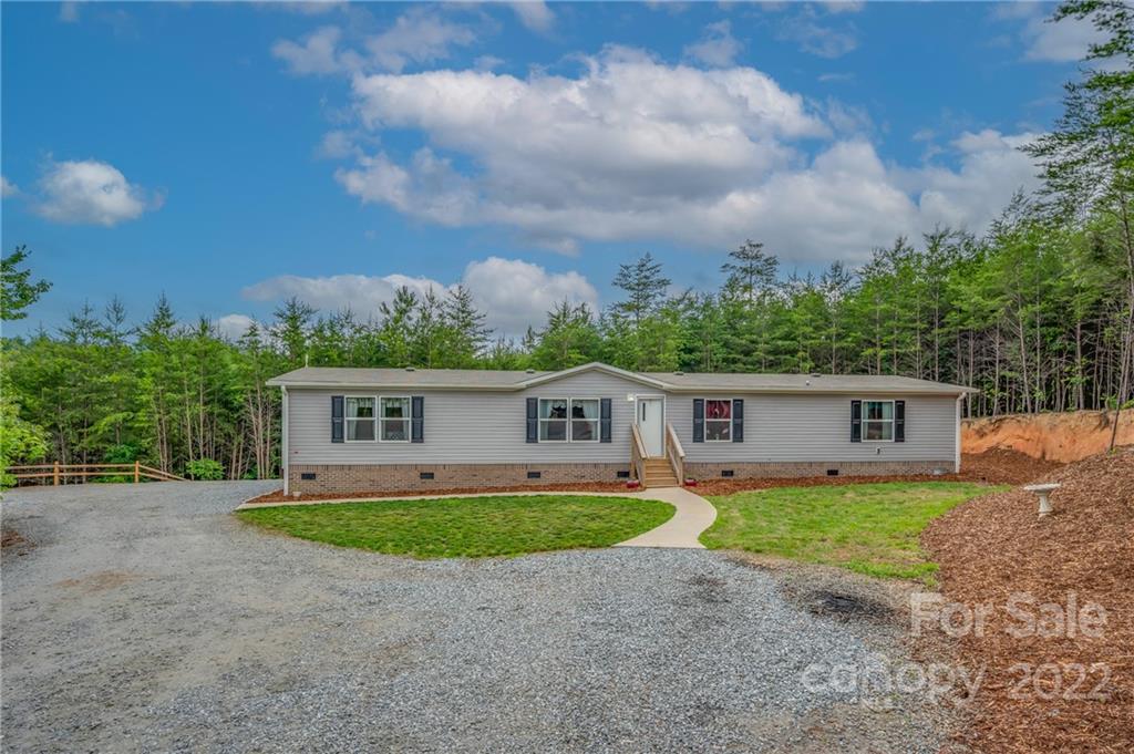 628 Hamilton Road Rutherfordton, NC 28139 - Photo 5 of 35 a view of a house with a yard