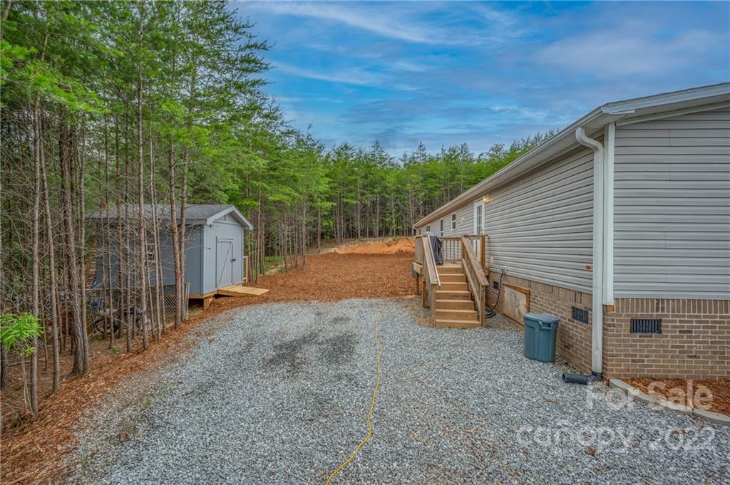 628 Hamilton Road Rutherfordton, NC 28139 - Photo 8 of 35 a view of a house with backyard and trees