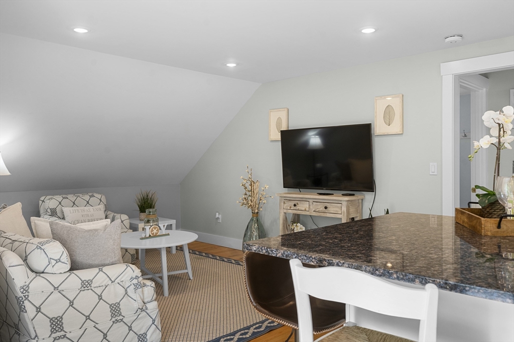 4 Hye Lane Edgartown, MA 02539 - Photo 32 of 41 a living room with furniture and a flat screen tv