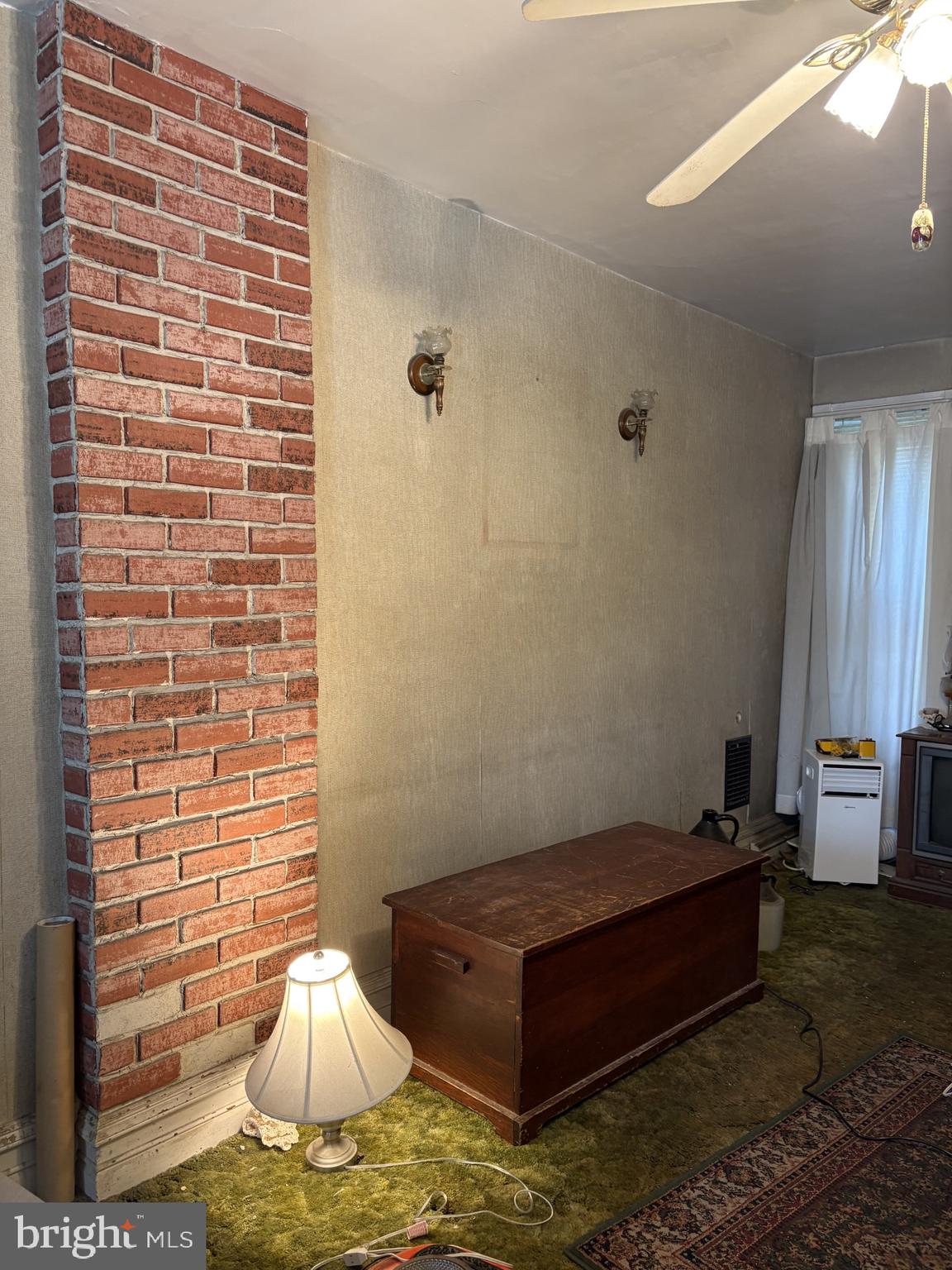 419 South 11th Street Reading, PA 19602 - Photo 3 of 13 a room with furniture and a window