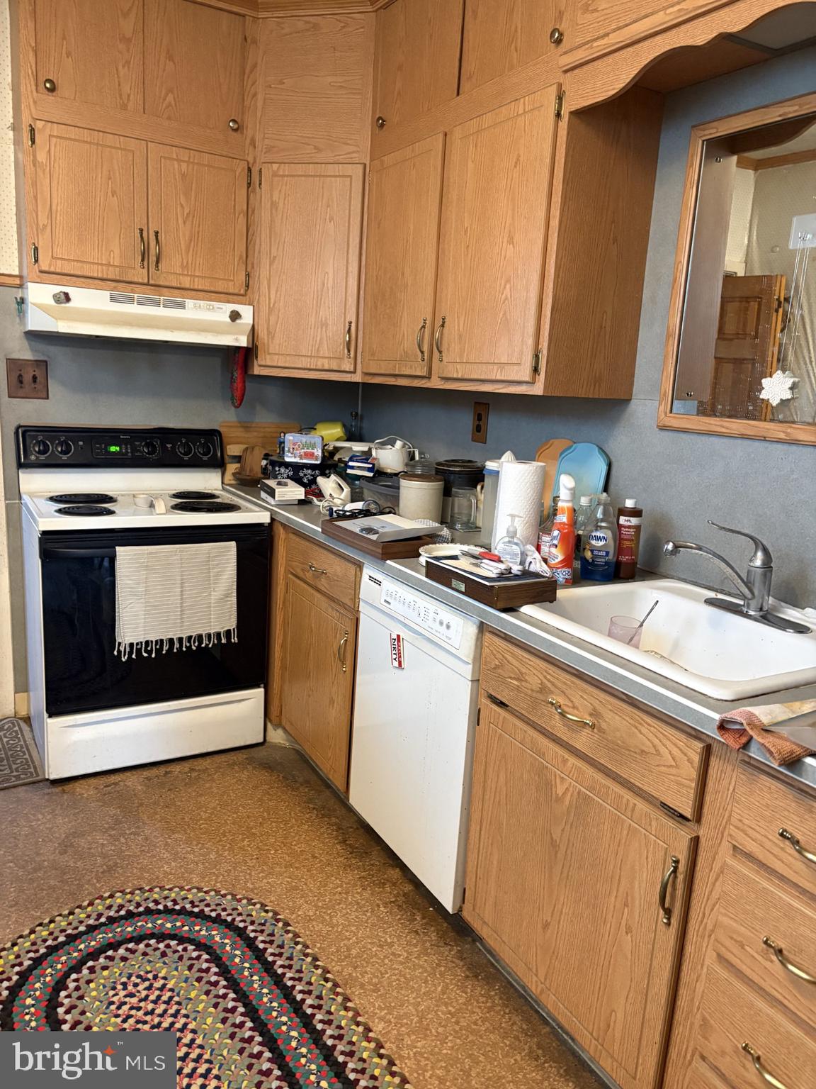 419 South 11th Street Reading, PA 19602 - Photo 4 of 13 a kitchen with stainless steel appliances granite countertop a stove a sink and a microwave