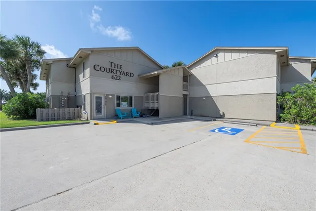 a view of a building with a road