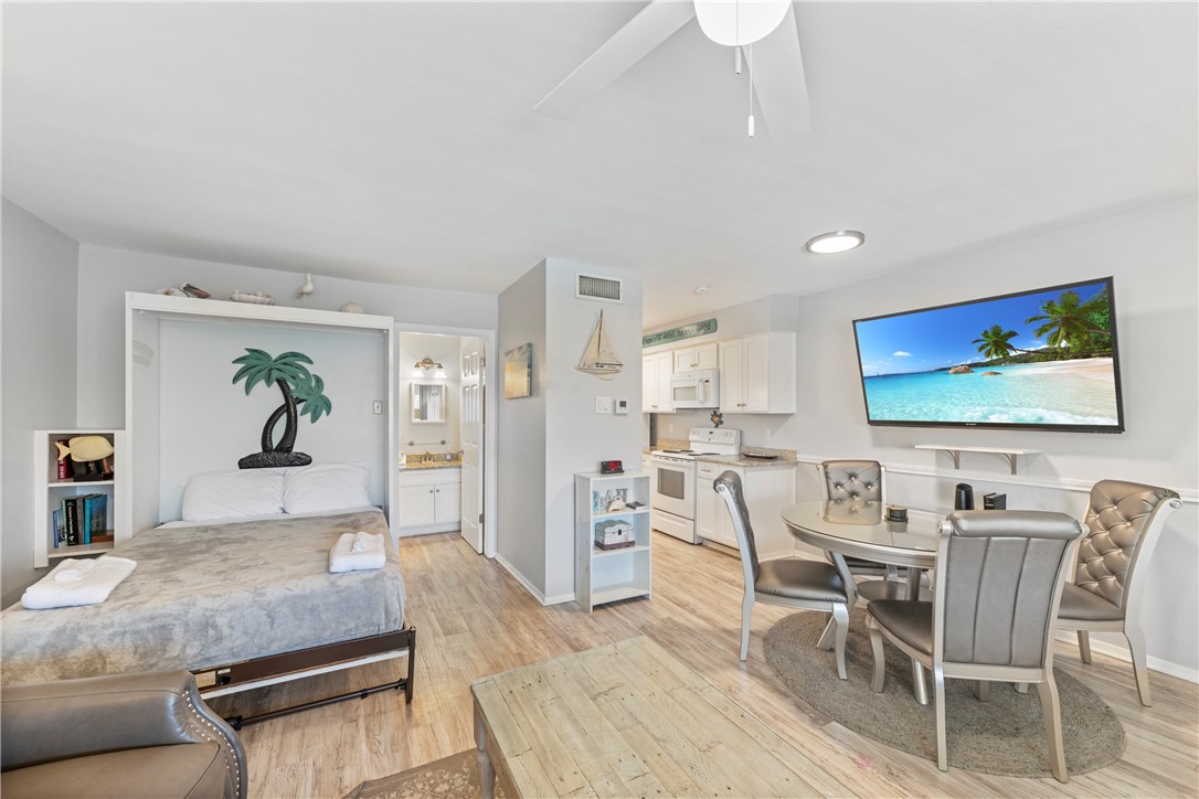 622 Beach Access Rd- 1a, Unit 231 Port Aransas, TX 78373 - Photo 5 of 24 a living room with furniture and a flat screen tv