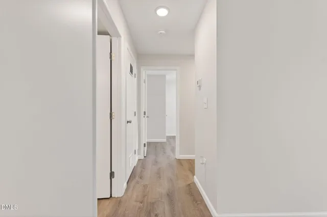 a kitchen with kitchen island a counter top space a sink and stainless steel appliances