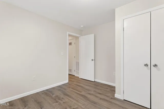a view of livingroom with hardwood floor and hallway