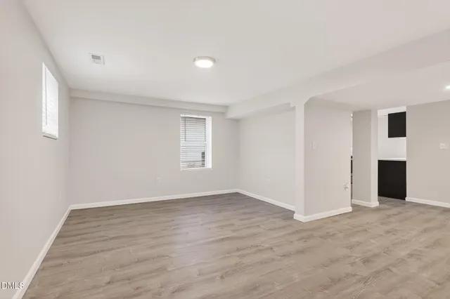 a backyard of a house with large trees