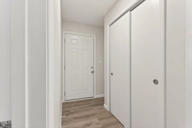 a bathroom with a toilet a sink a vanity and mirror