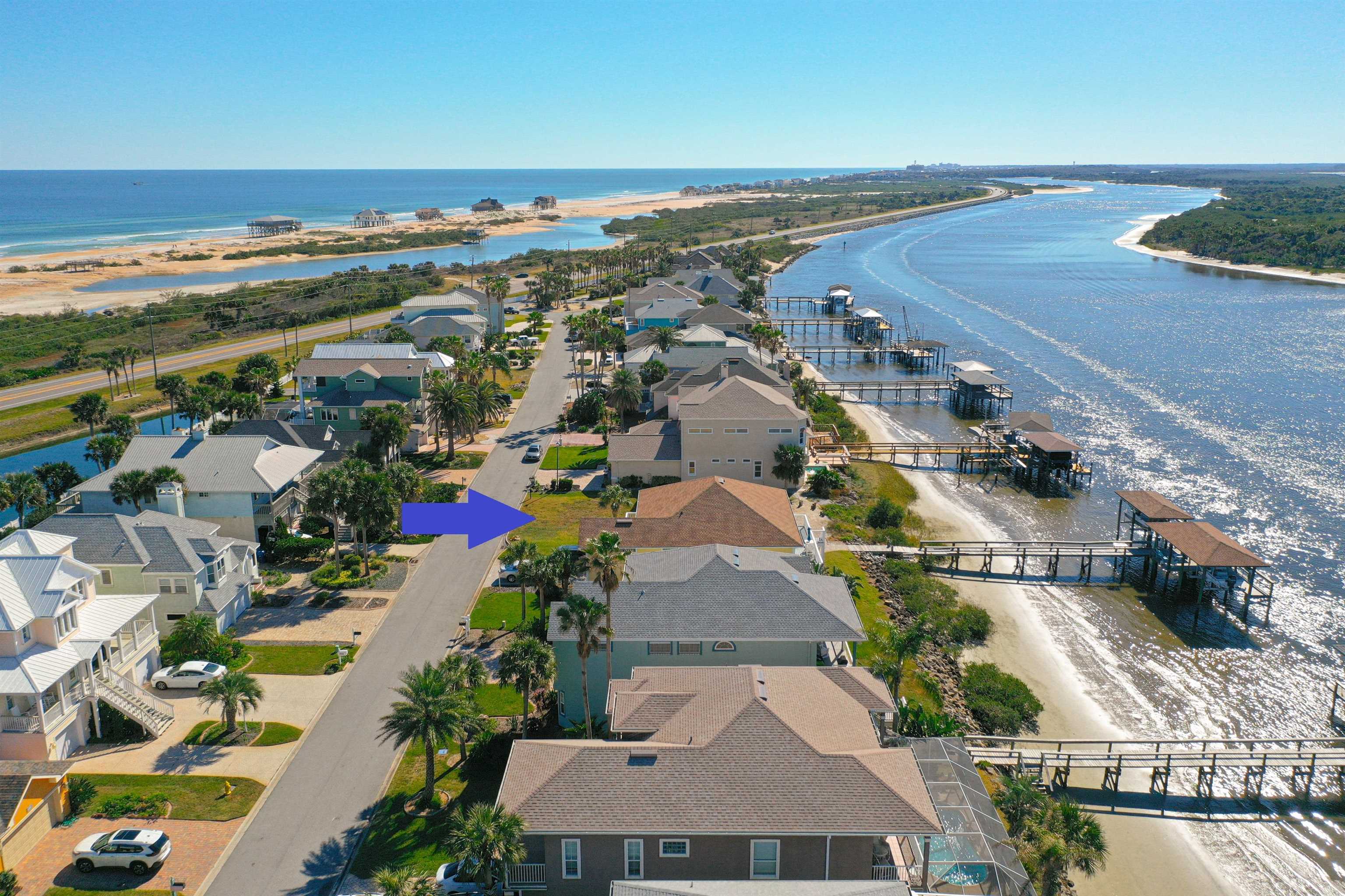 9241 July Lane St. Augustine, FL 32080 - Photo 1 of 18 an aerial view of ocean and residential houses with outdoor space