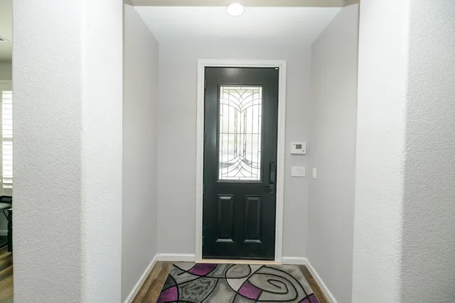a living room with furniture and a table