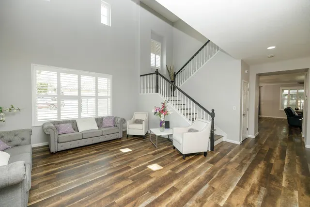 a dining room with wooden floor and a window