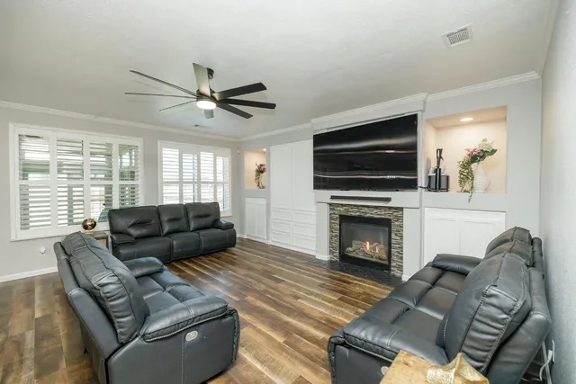 a large kitchen with kitchen island a sink stainless steel appliances and cabinets