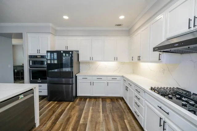 a view of a hallway with furniture and stairs