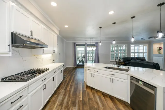 a bedroom with a bed and a ceiling fan