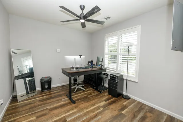 a bedroom with a bed and a tv